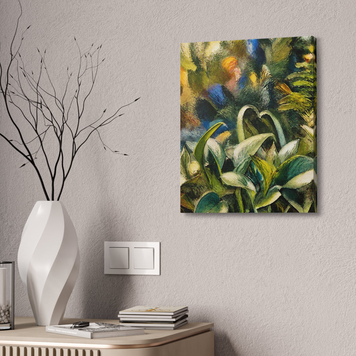 Wider Tangled Leaves botanical canvas on a textured wall beside a white branch-filled vase and wood cabinet.