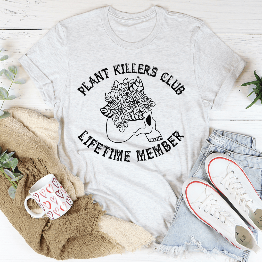 Plant Killers Club Lifetime Member graphic tee in ash, flat lay styled with jeans, sneakers, and a cozy blanket